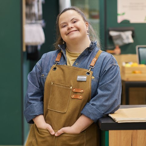 Woman with Down Syndrome in a carpenter’s apron
